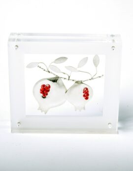 Handmade sterling silver pomegranates in plexiglass.